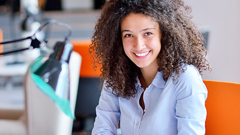 A businesswoman smiling in the office