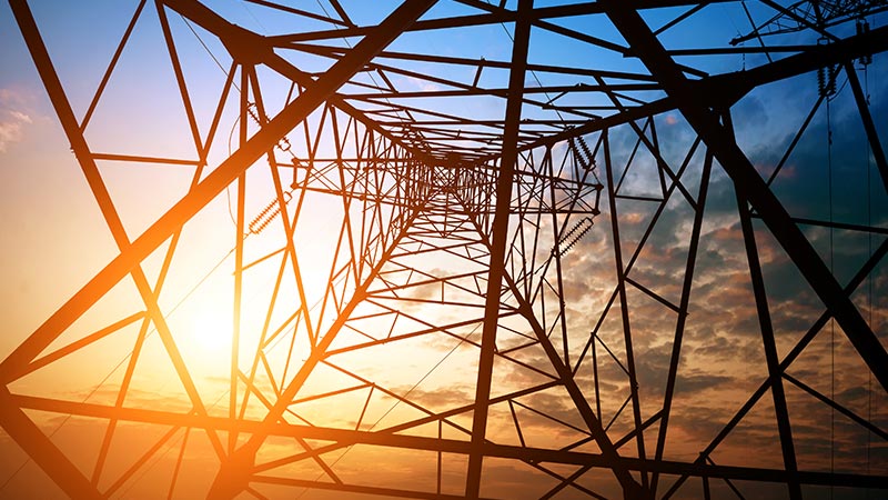 Looking up into an electricity tower