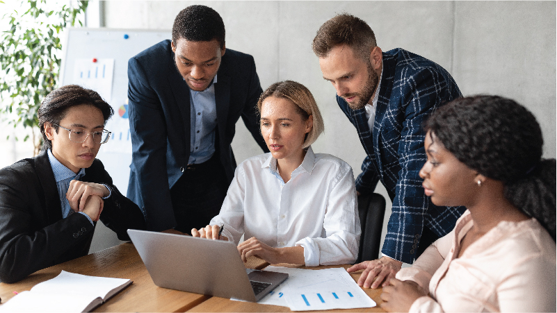 Group of five people having a meeting